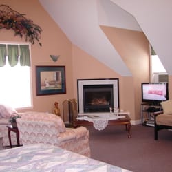 The Inn At the Ninth Hole - The Loft sitting area around the fireplace