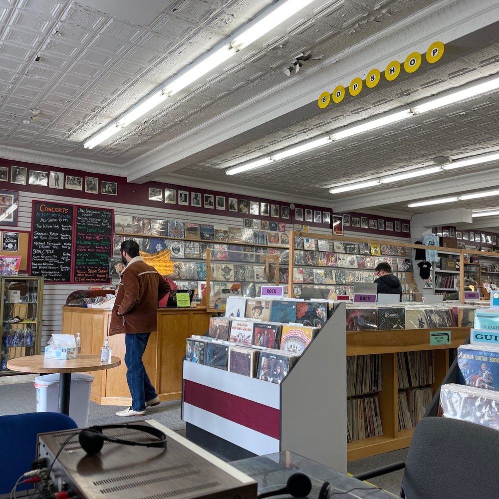 Bop Shop Records - a man standing in a record store - Vinyl Records Near Me - Rochester, New York Bop Shop Records - a man standing in a record store - Vinyl Records Near Me - Rochester, New York