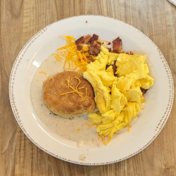 The Breakfast Company - Supreme Biscuit and cracked pepper gravy with scrambled eggs. - Breakfast & Brunch Near Me - Bradenton, Florida