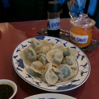 Dumpling Depot - Shrimp and chive dumplings (with vinegar and the delicious hot sauce in the background). - Dim Sum Near Me - Sunnyvale, California
