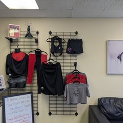 Brass Belles - Reception area shopping. Limited but fun Merchandise, grip aids and knees pads and accessories needed for class available