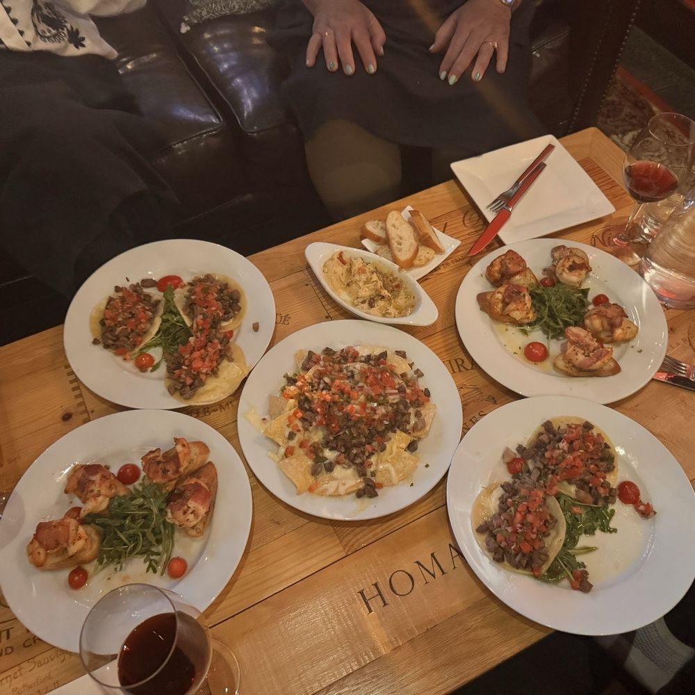 Tapas, steak, tacos, nachos, bacon, wrapped shrimp, and hummus Tapas, steak, tacos, nachos, bacon, wrapped shrimp, and hummus