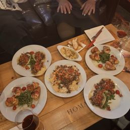 Tapas, steak, tacos, nachos, bacon, wrapped shrimp, and hummus