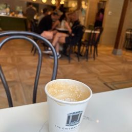 a cup of coffee on a table a cup of coffee on a table