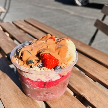 Roots & Rye - a dessert in a plastic cup on a wooden table - Acai Bowls Near Me - Pasadena, California Roots & Rye - a dessert in a plastic cup on a wooden table - Acai Bowls Near Me - Pasadena, California