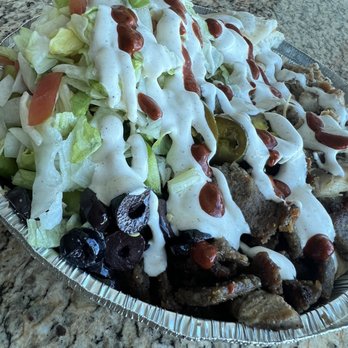 The Halal Guys - Another view of this beautiful combo platter (loaded up with sauce) - Halal Near Me - Fort Lauderdale, Florida The Halal Guys - Another view of this beautiful combo platter (loaded up with sauce) - Halal Near Me - Fort Lauderdale, Florida