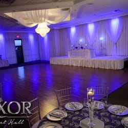 Luxor Banquet Hall - Large dance floor, stage with drapery and uplighting at the Luxor Banquet Hall. Quinceanera Reception in Dallas TX