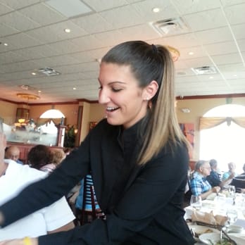 Spiro's - Our beautiful server, Ally grating cheese. - New American Near Me - Rocky Point, New York Spiro's - Our beautiful server, Ally grating cheese. - New American Near Me - Rocky Point, New York