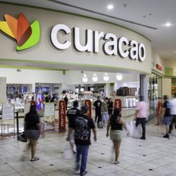 Desert Sky Mall - Shoppers walk past the Curacao store inside Desert Sky Mall.