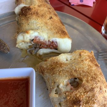 Pizza Salad Pointe & Self-Pour Beer - Stromboli cut open showing packed and filled with meat. - Pizza Near Me - Davie, Florida