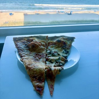 Benny Pazerelli's - Nope, they do not fit on a regular full size plate. And these are from a double cut pie so only 1/2 of a full slice ;-) - Pizza Near Me - Carolina Beach, North Carolina