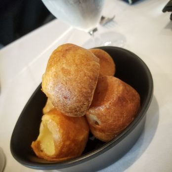Fogo De Chao - Cheesy bread. Sadly the only thing i photographed as i became too busy mowing through insane amounts of meats... - Brazilian Near Me - Bellevue, Washington Fogo De Chao - Cheesy bread. Sadly the only thing i photographed as i became too busy mowing through insane amounts of meats... - Brazilian Near Me - Bellevue, Washington