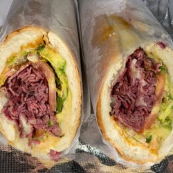 Pastrami on a hero w/ lettuce, tomatoes, onions, avocado, Swiss cheese and chipotle mayo Hot.