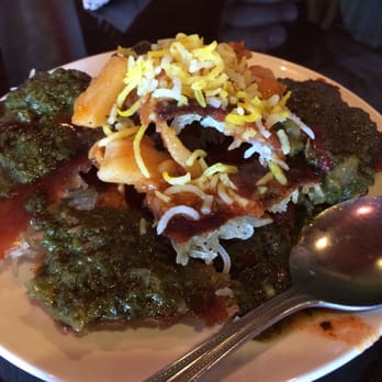 Caspian Grill - tahtigh. an appetizer made of rice and topped with stew - Persian/Iranian Near Me - Austin, Texas