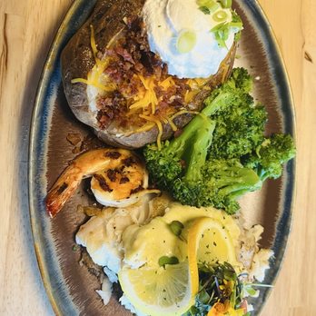 The Feast Restaurant - Grouper covered with shrimp and crab and loaded potato - Seafood Near Me - Holmes Beach, Florida