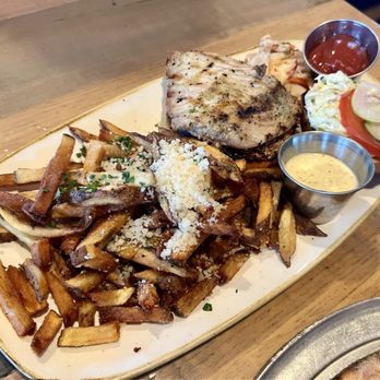 Monkeypod Kitchen by Merriman - Mahimahi Fish Sandwich with side order garlic fries - New American Near Me - Kihei, Hawaii Monkeypod Kitchen by Merriman - Mahimahi Fish Sandwich with side order garlic fries - New American Near Me - Kihei, Hawaii