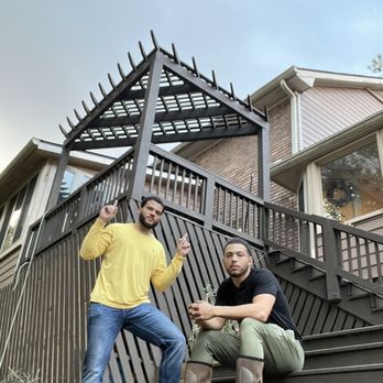 Local Boyz - a man and a woman on the steps of a house - Landscaping Near Me Local Boyz - a man and a woman on the steps of a house - Landscaping Near Me