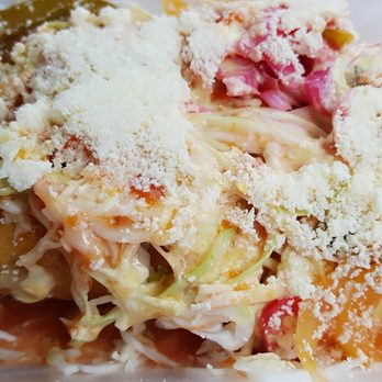 Tipicos Antojitos Hondureños - Yep, there are 2 large rolled tacos under there!  Tacos Honrudenos - Food Trucks Near Me - Jacksonville, Florida