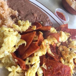 Chilaquiles with no cheese and scrambled eggs. Chilaquiles with no cheese and scrambled eggs.