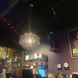 a bar with a chandelier