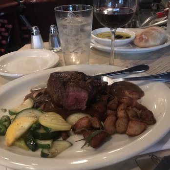 Oliviana Ristorante & Bar Italiano - Medium filet with an Argentinian Malbec in the background. Very good execution and pairing tonight! - Italian Near Me - Augusta, Georgia Oliviana Ristorante & Bar Italiano - Medium filet with an Argentinian Malbec in the background. Very good execution and pairing tonight! - Italian Near Me - Augusta, Georgia
