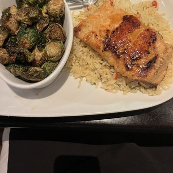 LongHorn Steakhouse - Grilled Salmon over a bed of rice pilaf  Balsamic glazed Brussel sprouts - Steakhouses Near Me - Largo, Maryland