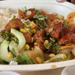 Half eaten chicken, rice, and veggie bowl. Yummy!