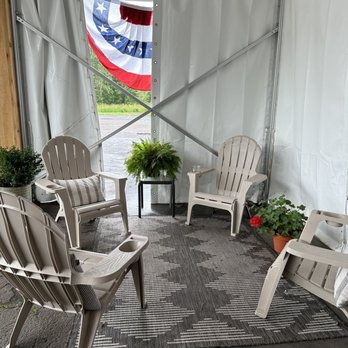 Taste Coffee - a patio area with chairs and a potted plant - Coffee & Tea Near Me - Mason, Michigan