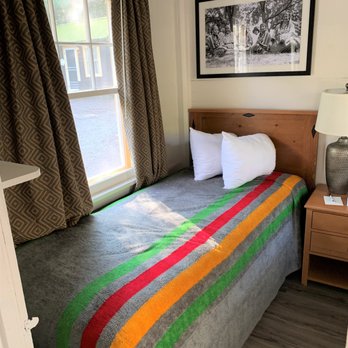 Swiftcurrent Motor Inn - The interior was very cozy and quaint. I appreciated staying inside the cabins here at Swiftcurrent Motor Inn. - Hotels Near Me