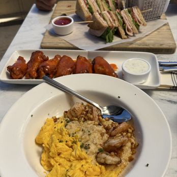 Feast and Fareway - Traditional Club Sandwich with onion rings, House Chicken Wings, and Southern Shrimp & Grits with scrambled eggs - American Near Me - Coronado, California