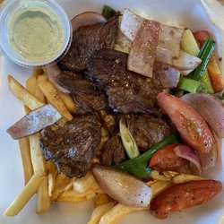 Red Fuego - Red Fuego Lomo Saltado. There's rice in there under all the goodies.