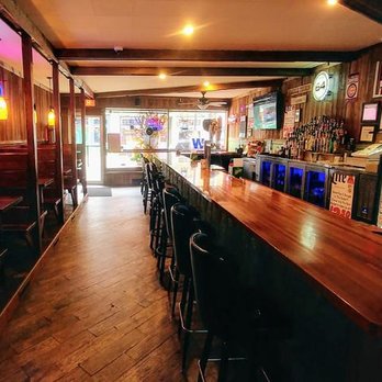 Small Town Saloon - a bar with wooden counter and bar stools - Bars Near Me - Elizabeth, Illinois Small Town Saloon - a bar with wooden counter and bar stools - Bars Near Me - Elizabeth, Illinois