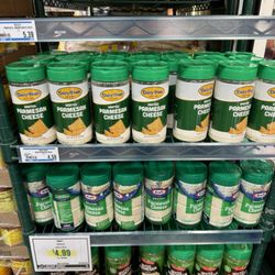 Holiday Market - Wide selection of grated Parmesan and Romano cheeses.