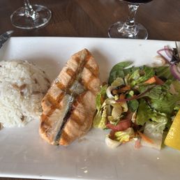 Grilled Salmon, rice, and Mediterrainean salad.