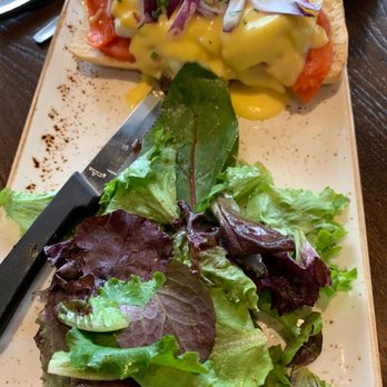 First Watch - This is the Smoked Salmon Eggs Benedict smothered in hollandaise sauce with onions and vine ripened tomatoes with some mixed greens. - Breakfast & Brunch Near Me - Austin, Texas First Watch - This is the Smoked Salmon Eggs Benedict smothered in hollandaise sauce with onions and vine ripened tomatoes with some mixed greens. - Breakfast & Brunch Near Me - Austin, Texas
