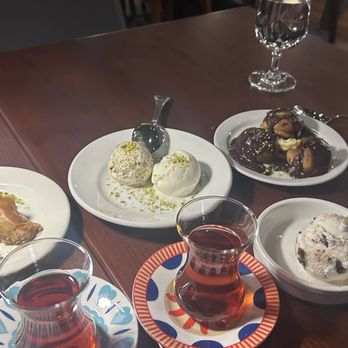 Meyhouse - Plethora of desserts:  baklava, 2 types of pistachio ice creams, puff pastry with chocolate and pistachio, chocolate and cherry ice cream - Turkish Near Me - Sunnyvale, California