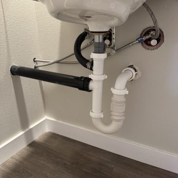 SNEGroup - This is the clean piping work these gentlemen did. They connected piping from the salon sink into my sink into the bathroom wall. - Handyman Near Me