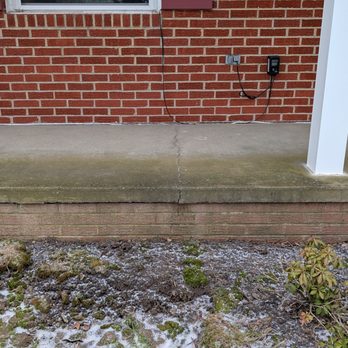 R. Chapman Masonry & Construction Company - Cracks in the original foundation and concrete porch slab, due to the foundation settling. - Masonry/Concrete Near Me R. Chapman Masonry & Construction Company - Cracks in the original foundation and concrete porch slab, due to the foundation settling. - Masonry/Concrete Near Me