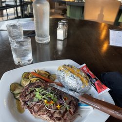 Cantilever Distillery - Ribeye with baked potato and grilled veggies, house salad included is so good- the ranch dressing is the best I have ever had.