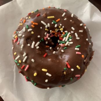 Fosters Donuts - a chocolate donut with sprinkles - Donuts Near Me - Delano, California