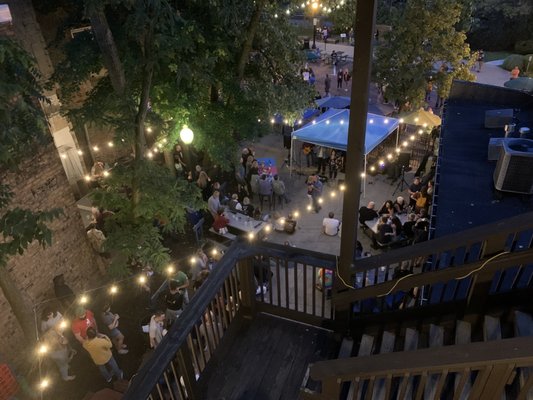 Photo of Zephyr Pub & Spirits - Kent, OH, US. View of outdoor music at night from the third floor outdoor patio