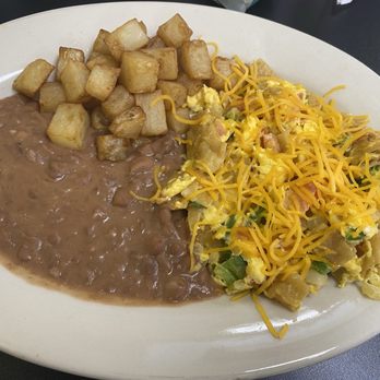 Taqueria Flores - Migas a la Mexicana with refried beans and potatoes - Mexican Near Me - Santa Fe, Texas Taqueria Flores - Migas a la Mexicana with refried beans and potatoes - Mexican Near Me - Santa Fe, Texas