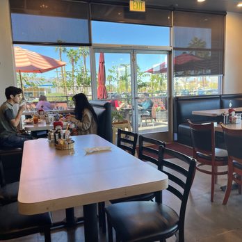 The Palms Cafe - Roomy booths and tables. Glimpse of outdoor seating. - Cafes Near Me - La Quinta, California