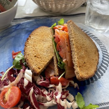 Blu Bar - Lightly toasted Rye used in a Salmon sandwich, with lettuce, salmon, tomato and that's it. Have a drink handy - Bars Near Me - Positano, SA
