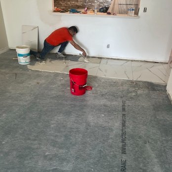 Monarch Contracting Group - Process of applying tile flooring - General Contractors Near Me - Flushing, New York