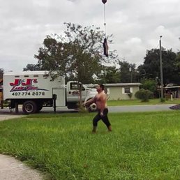 a man carrying a dog