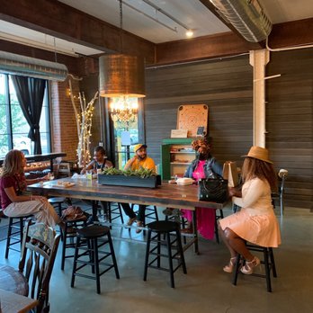 Company B. Tasting Room - a group of people sitting around a table - Cideries Near Me - Buffalo, New York Company B. Tasting Room - a group of people sitting around a table - Cideries Near Me - Buffalo, New York