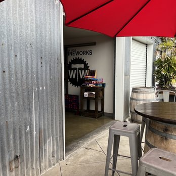 La Mesa Wine Works - a patio area with a table and stools - Wine Tasting Room Near Me - La Mesa, California