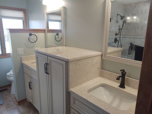 Bauer’s MaterBathroom Renovation - This master-bathroom renovation included completely gutting dated bathroom, and redesigning the space. All new layout, flooring, custom cabinets, fixtures, quartz countertops, lighting ,adding new spacious linen closet.