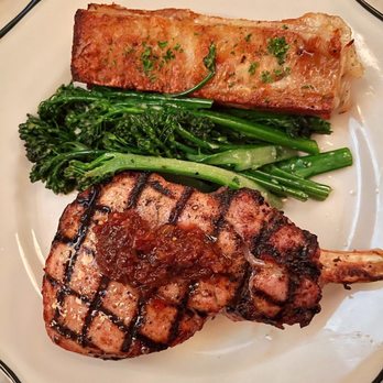 Bar Cecil - SMOKED BONE-IN DUROC PORK CHOP Potatoes Au Gratin. Broccolini. Seasonal Chutney. - Cocktail Bars Near Me - Palm Springs, California